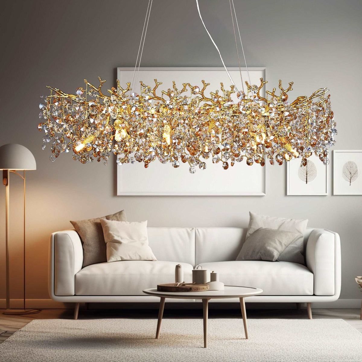 Albero crystal dining chandelier on a gold frame over a table
