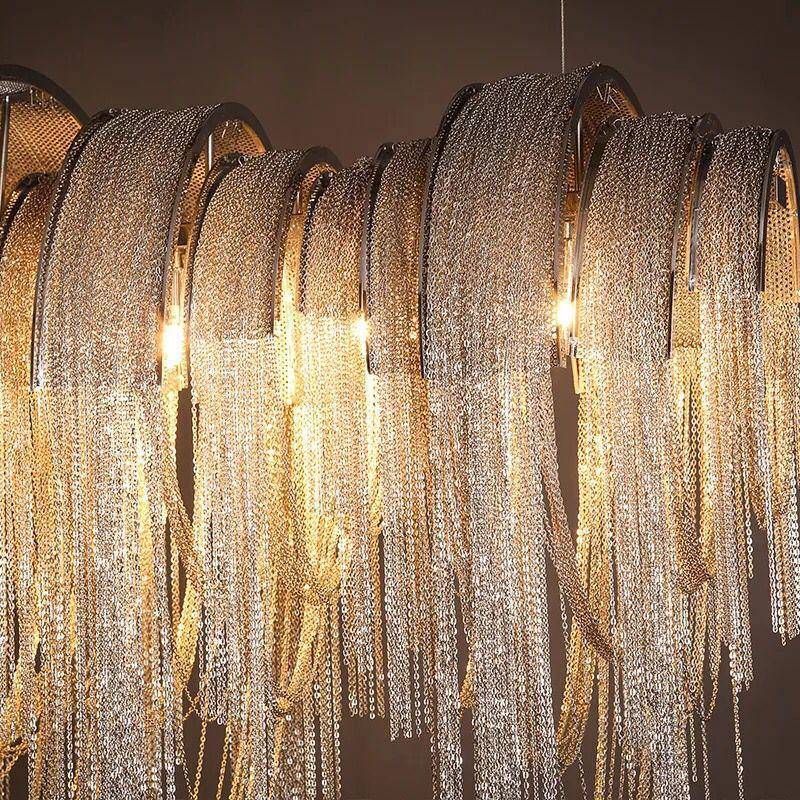 Detail of the Cadena dining chandelier's fine aluminum chain tassels, from Morsale.com.