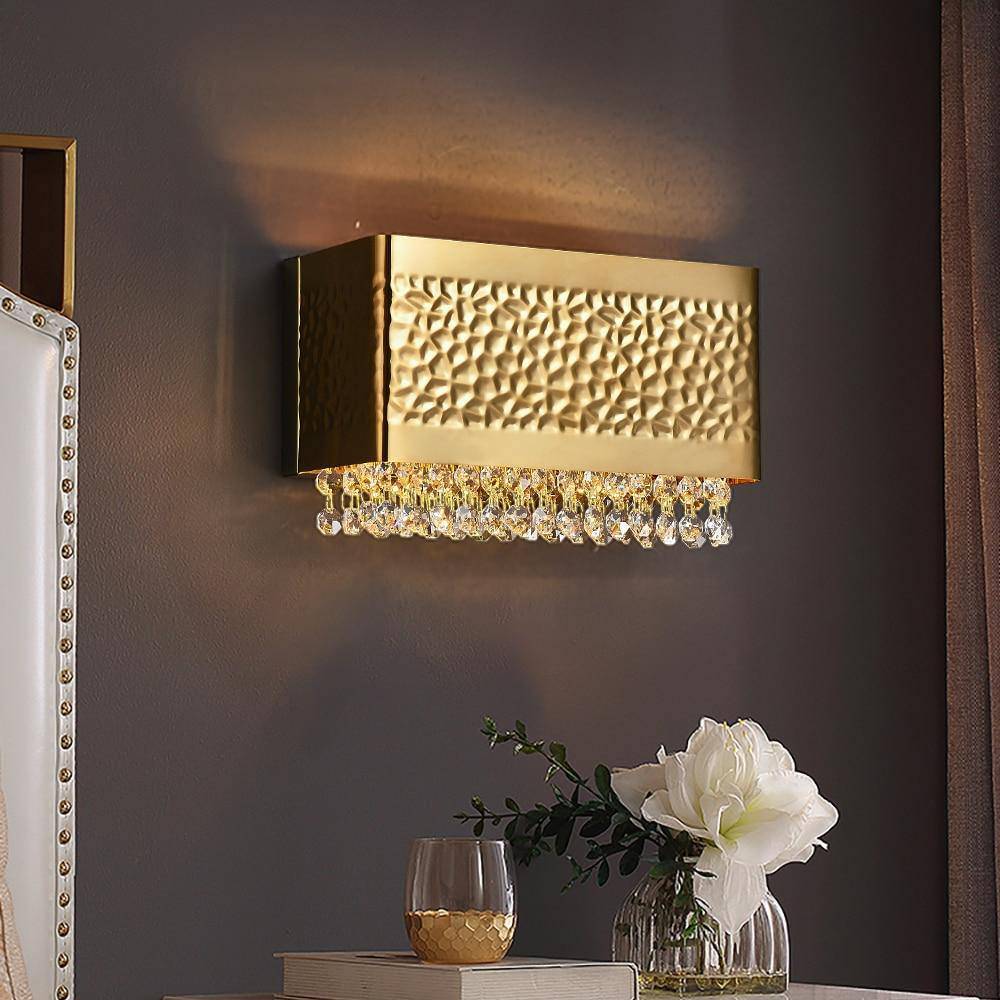 Bern gold plated wall sconce by Morsale.com, clear K9 crystal on a compact gold stainless steel frame casting soft warm light.
