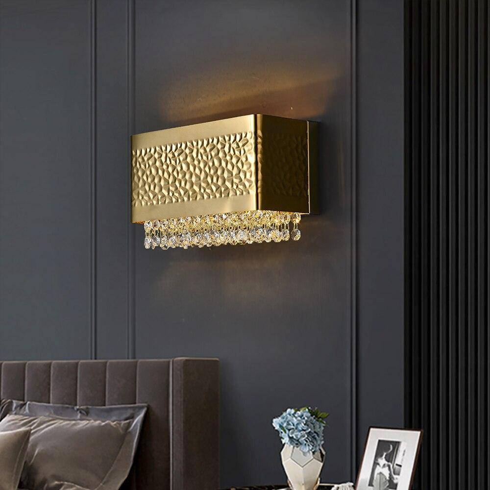 Bern gold plated wall sconce by Morsale.com, clear K9 crystal on a compact gold stainless steel frame casting soft warm light.