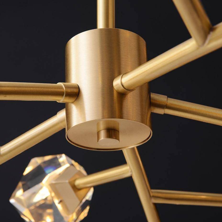 Detail of a clear crystal orb on the Diamante chandelier's brushed copper frame, from Morsale.com.