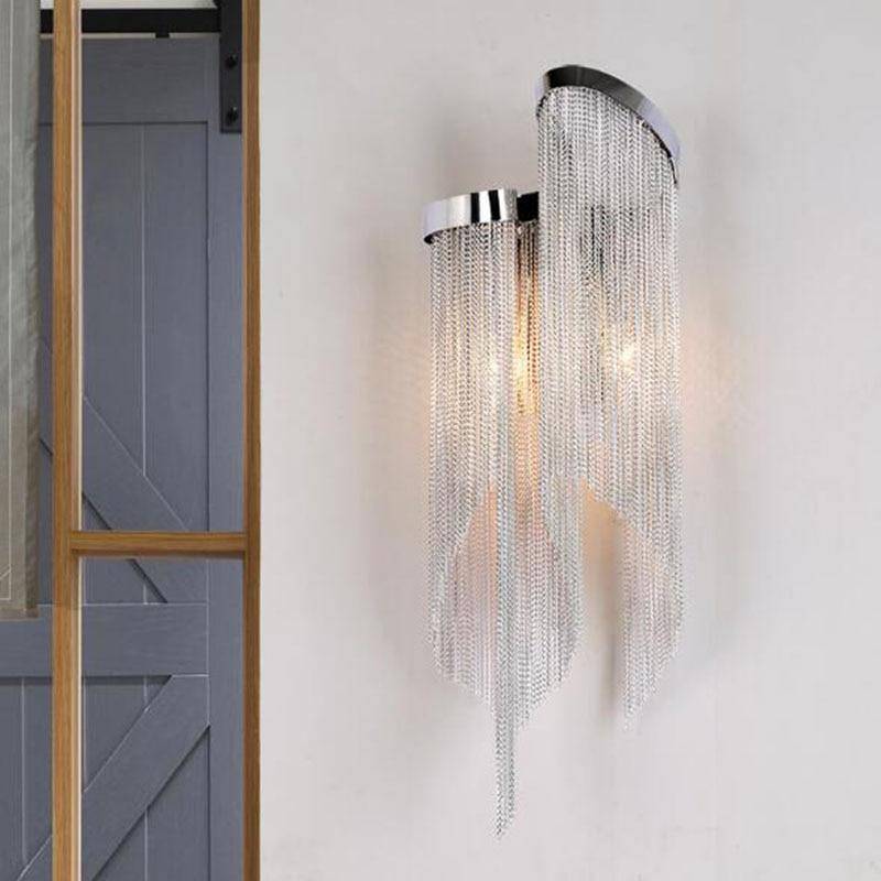 Side view of the Cadena chain tassel wall sconce by Morsale.com showing the layered aluminum and steel form.