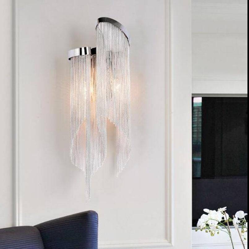 Cadena chain tassel wall sconce by Morsale.com, cascading aluminum tassels on a stainless steel backplate with two warm lights.