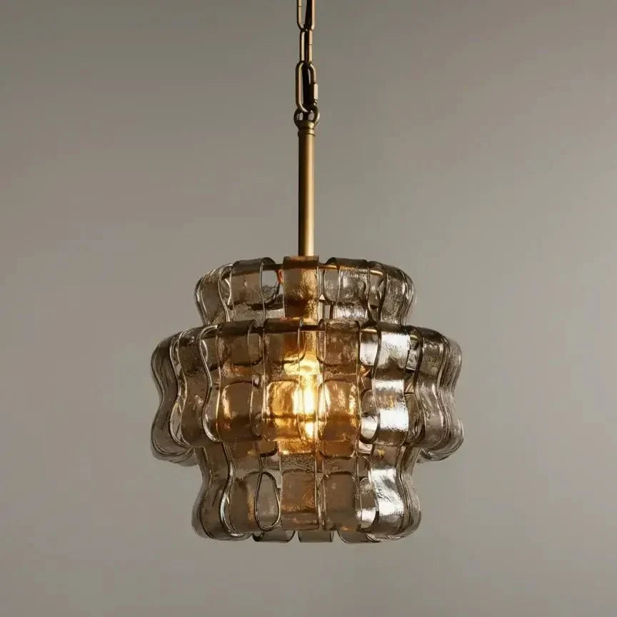 Riviera smoke glass pendant illuminated over a kitchen island