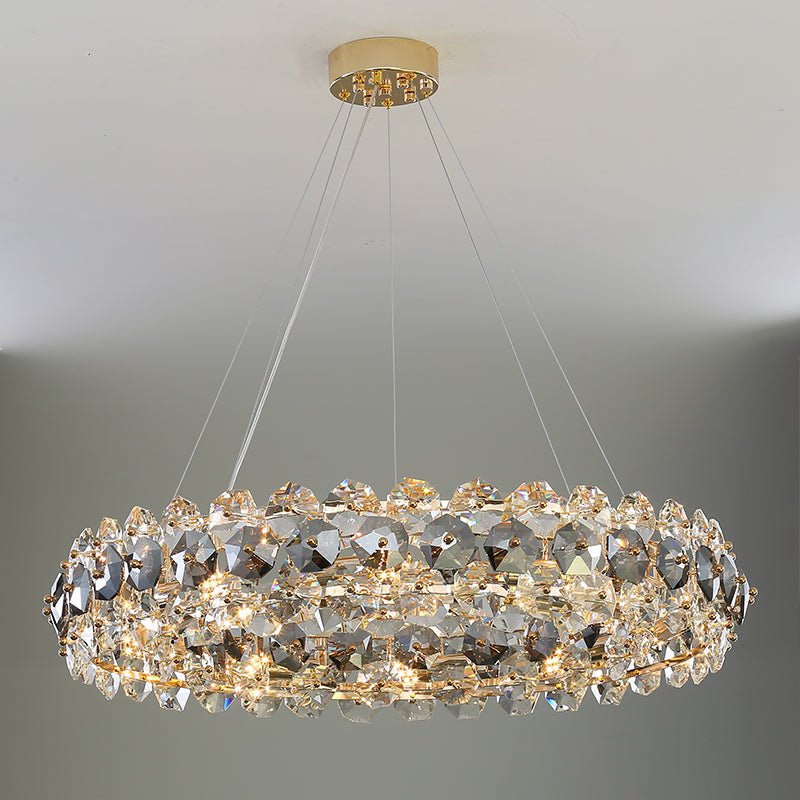 Monte crystal wheel chandelier by Morsale.com, a 31-inch wheel of smoke grey and clear K9 crystal on a polished steel frame above a dining table.