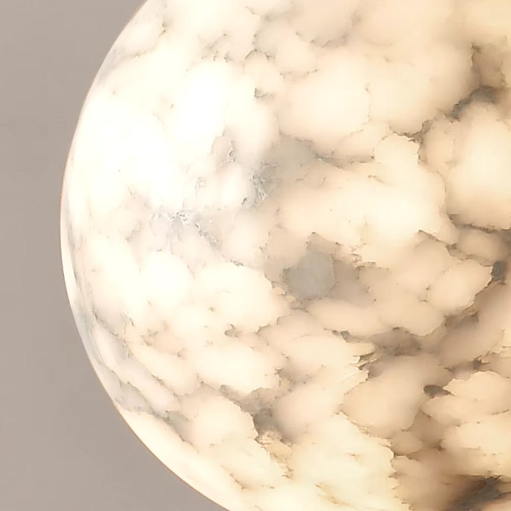 Solara marble orb pendant with brass detailing in a kitchen