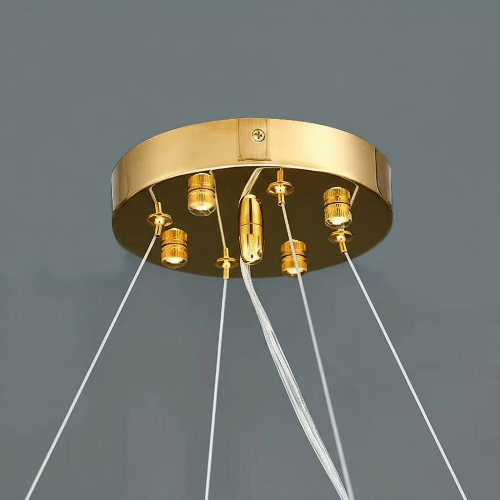 Close-up of the hammered gold frame on the Alleri chandelier