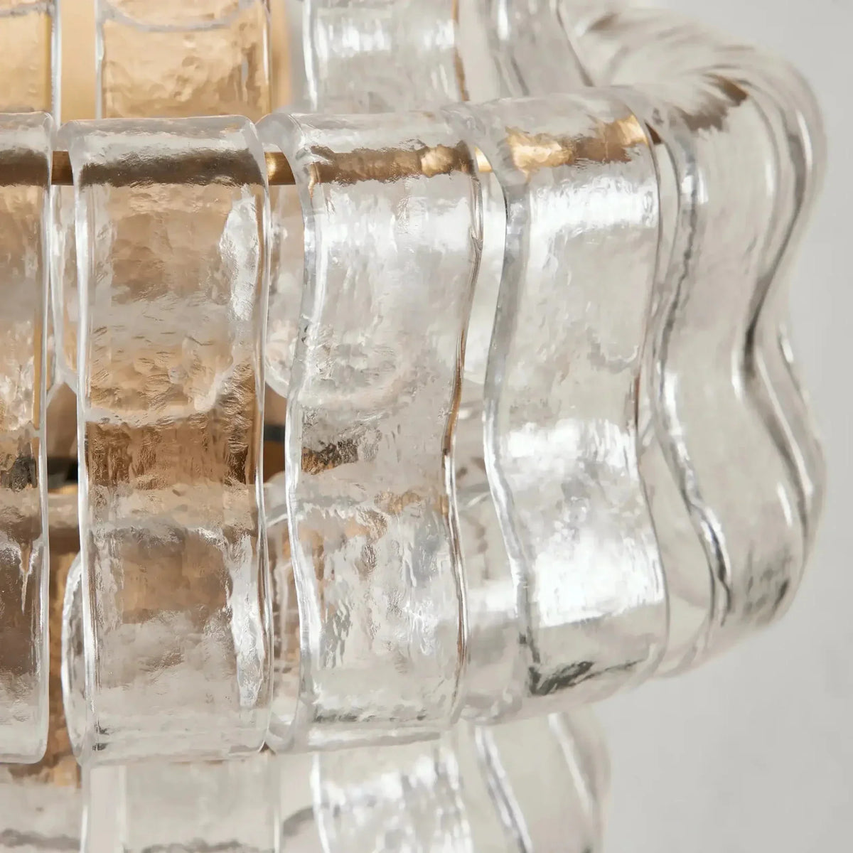 Riviera glass wall sconce mounted on a wall