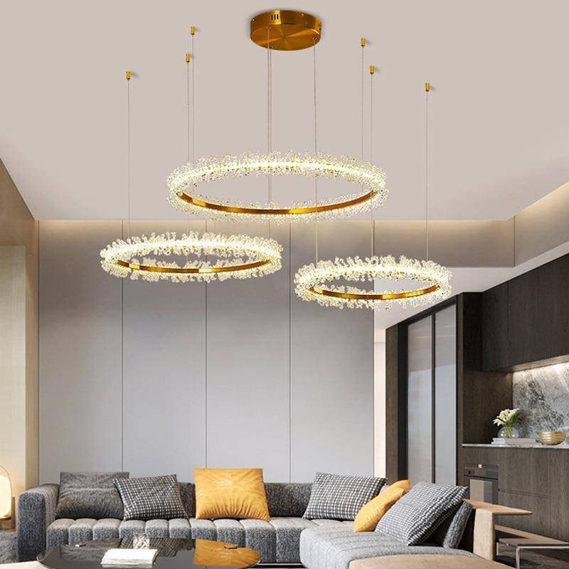The Capri 3-ring chandelier from Morsale.com casting a refined glow, tiered crystal rings with concealed LED strips.