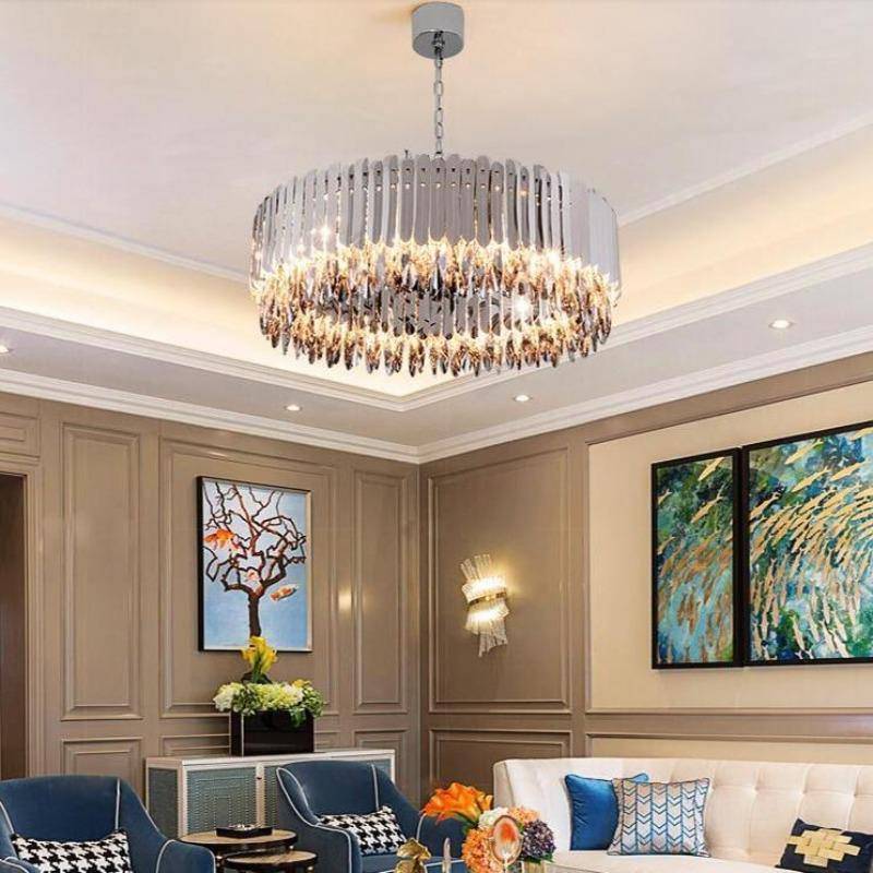 The Legance chandelier by Morsale.com illuminated in a living room, smokey crystals with warm E14 LED glow.