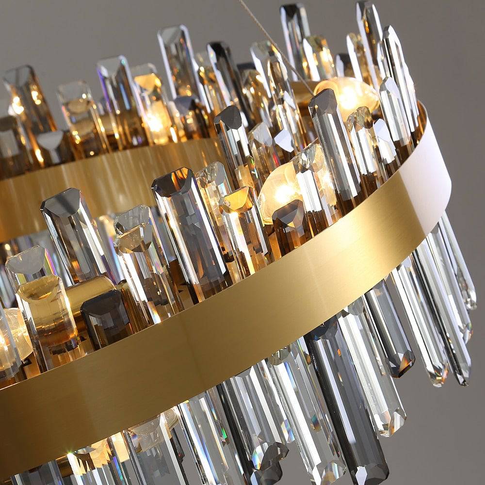 The Asti crystal chandelier from Morsale.com casting layered light and reflection, clear and smoke crystal on brushed steel.