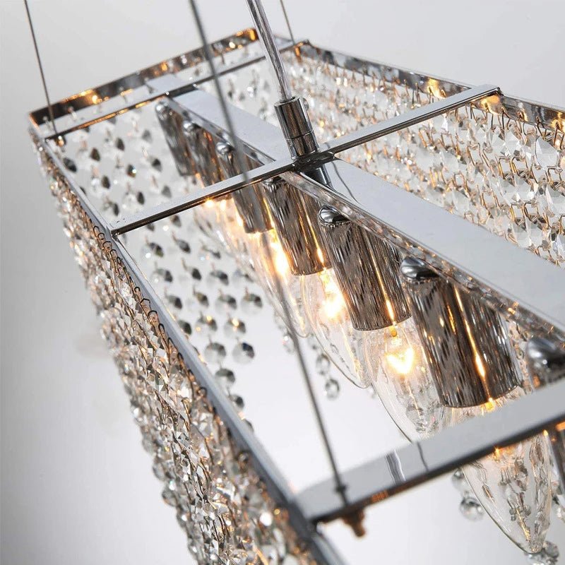 Cascading clear crystal tassels on a polished steel frame