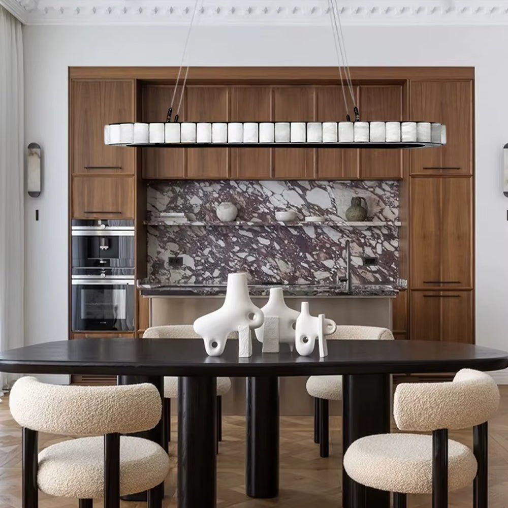 Hampton marble dining chandelier illuminated above a table