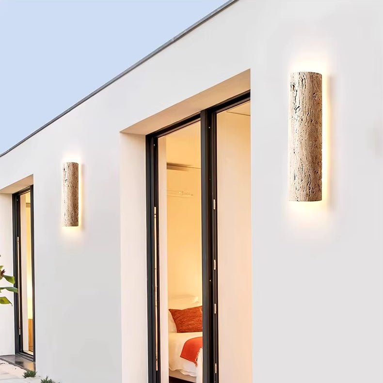 Solterra travertine wall sconce on an outdoor covered wall