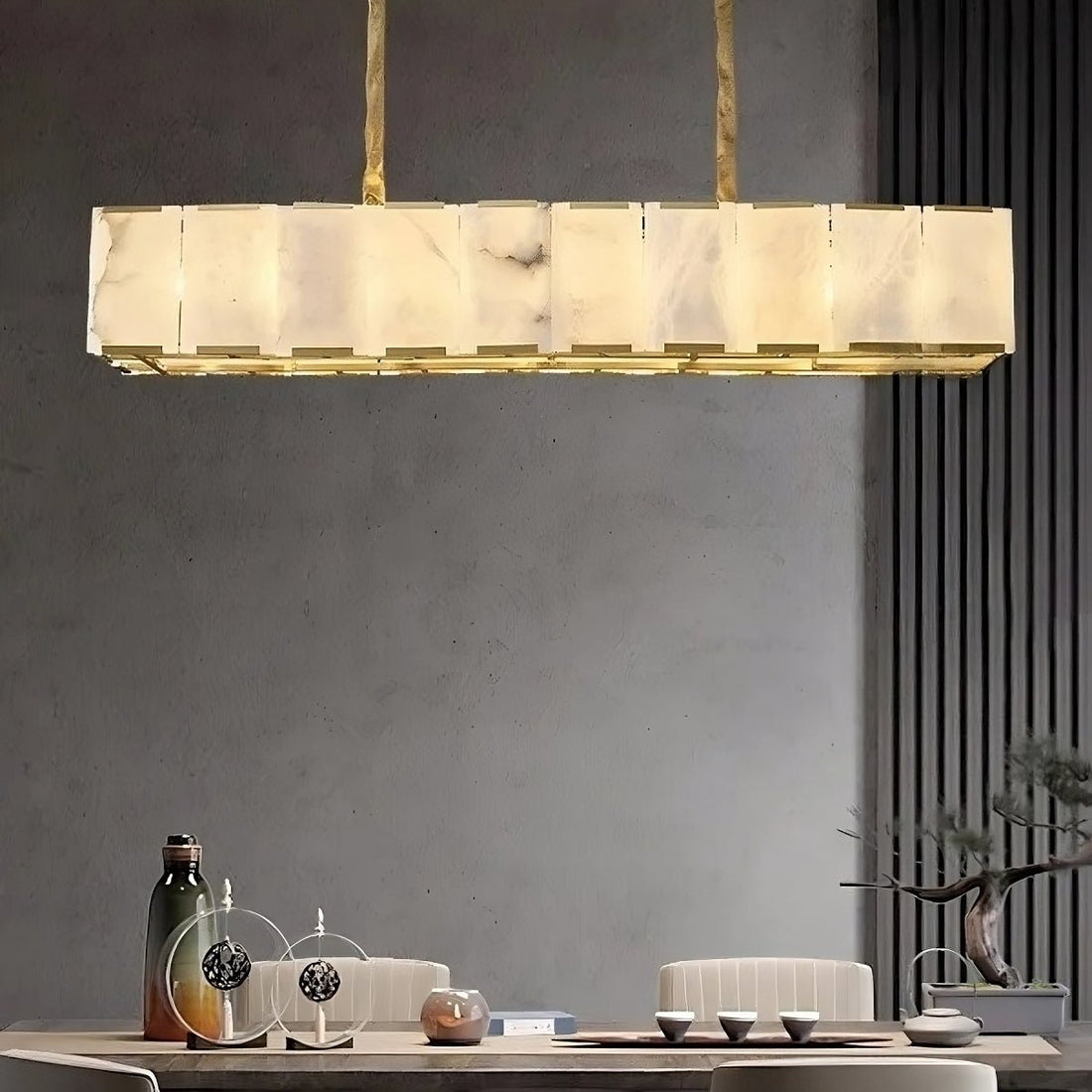 Modern dining room with wooden table, white chairs, and a pendant light.