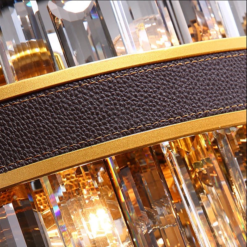 Calvi crystal dining chandelier illuminated above a kitchen island