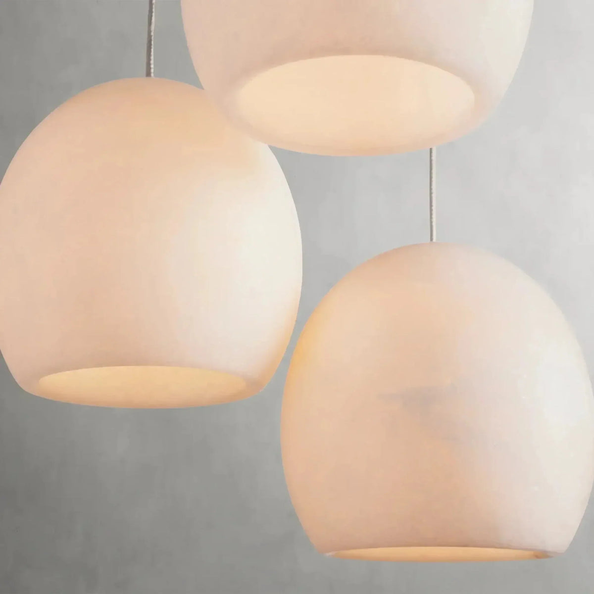 Detail of natural marble shades on the Auris chandelier