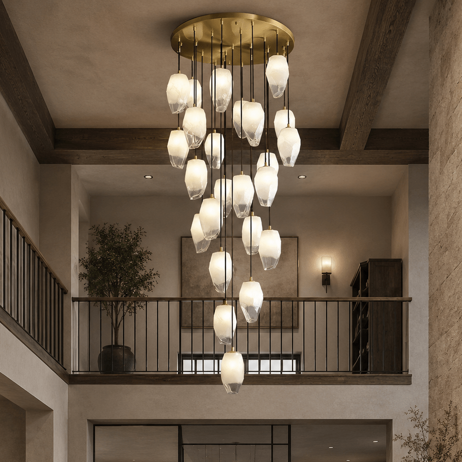 Modern chandelier hanging in a room with wooden beams and a staircase.