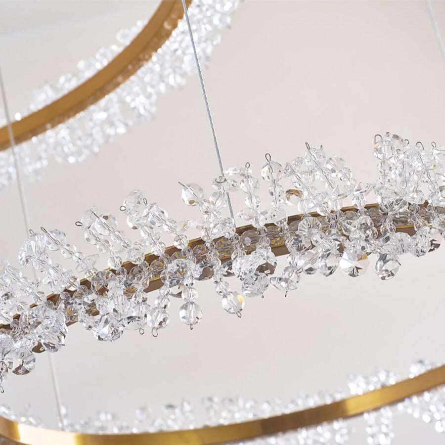 Angled view of the Capri tiered chandelier by Morsale.com showing the balanced ring proportions and crystal detail.