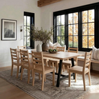 Dining room with wooden table and chairs, large window, and rug.