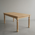 Wooden table with twisted legs on a plain background