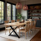 Dining room with wooden table and chairs, large windows, and decorative elements.