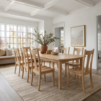 Dining room with wooden table and chairs in a bright room.