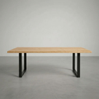 Wooden table with black legs on a gray background