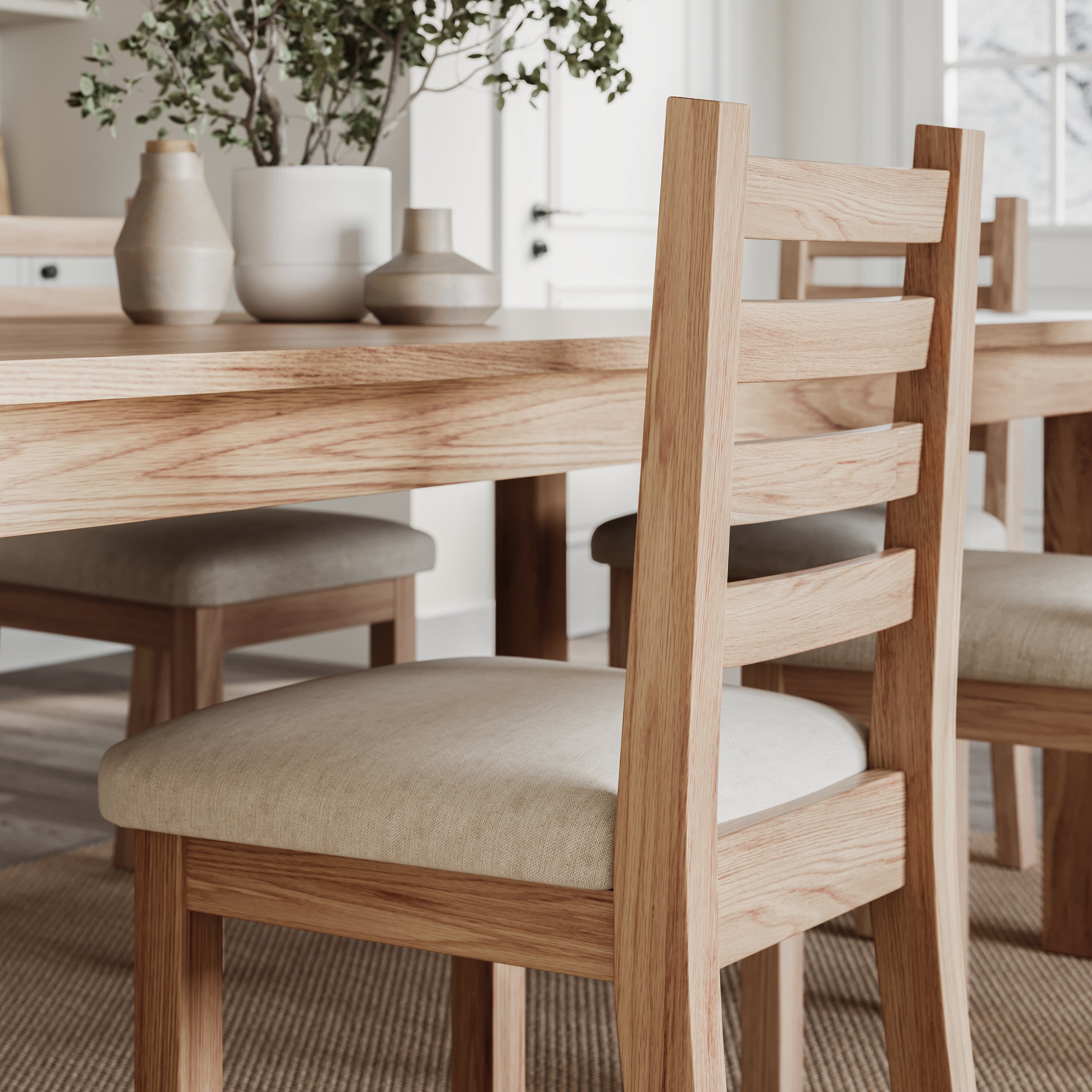 close up image of the side of an oak dining table with matching chairs