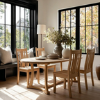 Dining room with wooden table and chairs, large vase of flowers, and a window.