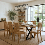 Dining room with wooden table and chairs, large window, and decorative elements.