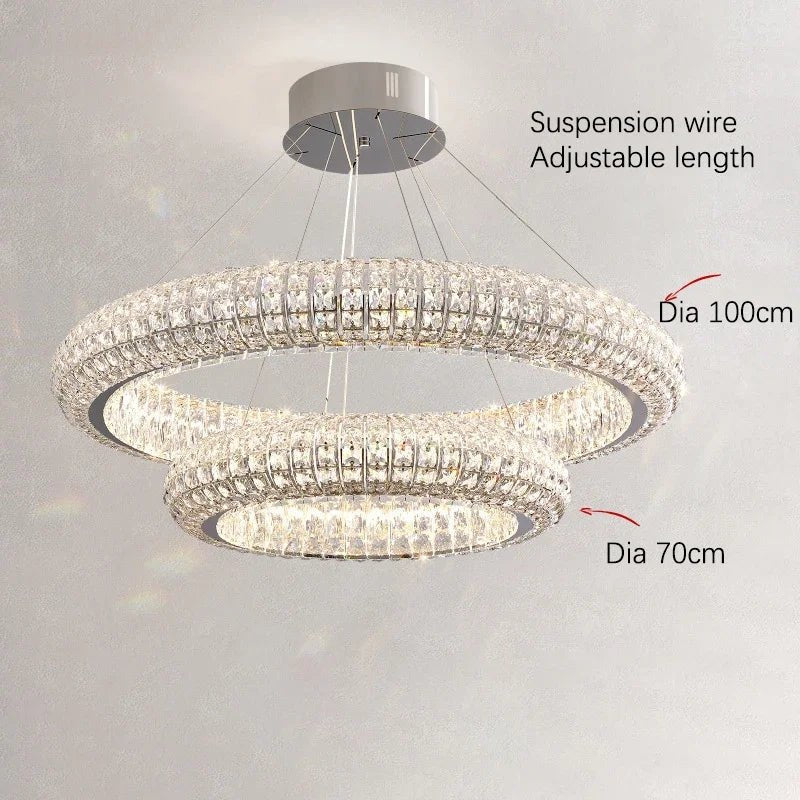 Bacci grand crystal chandelier illuminated in a foyer