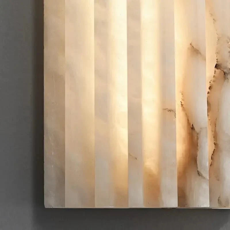 Marlo marble sconce warm glow detail