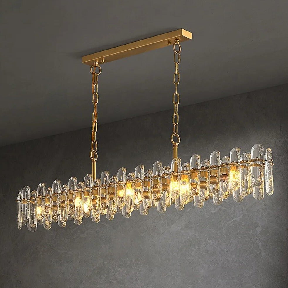Marini crystal dining chandelier illuminated above a kitchen island