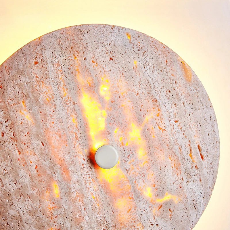 Brighton travertine wall sconce mounted on a wall