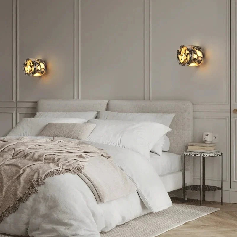 Valmont marble sconce with glowing stone shade