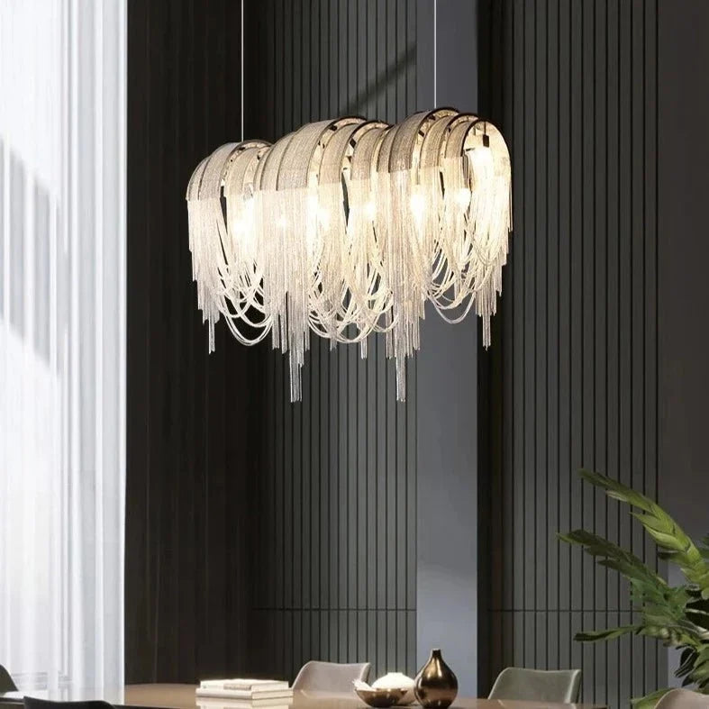 Side view of the Cadena chain tassel dining chandelier by Morsale.com showing the long linear tassel curtain.