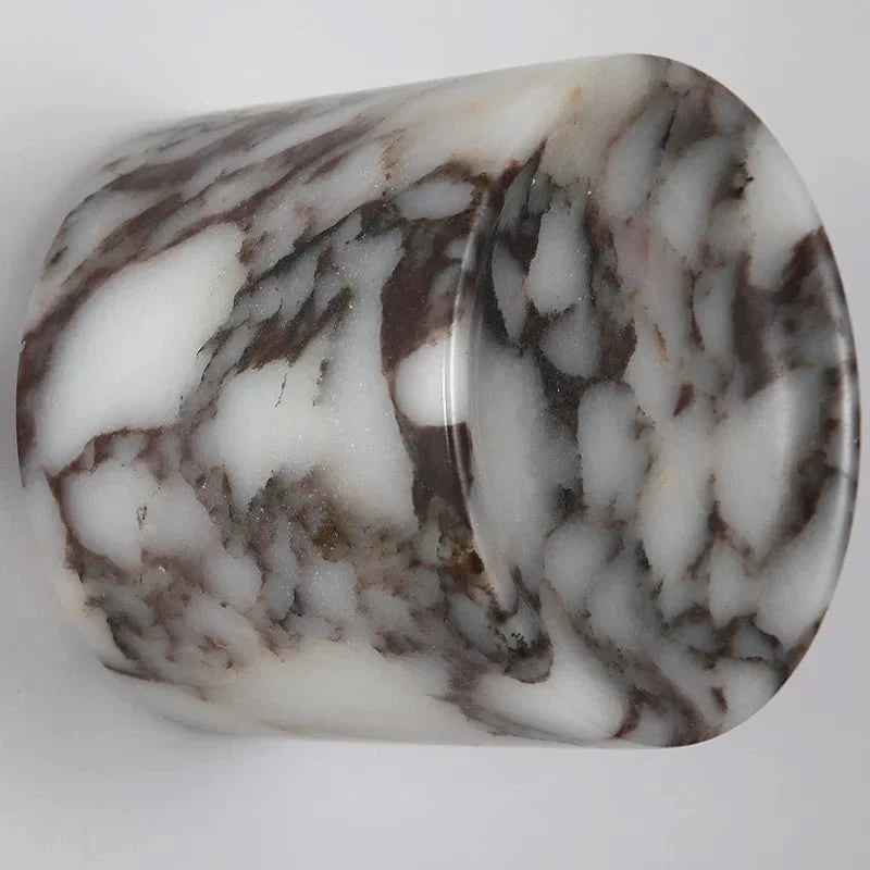 Valmont marble sconce mounted on a wall