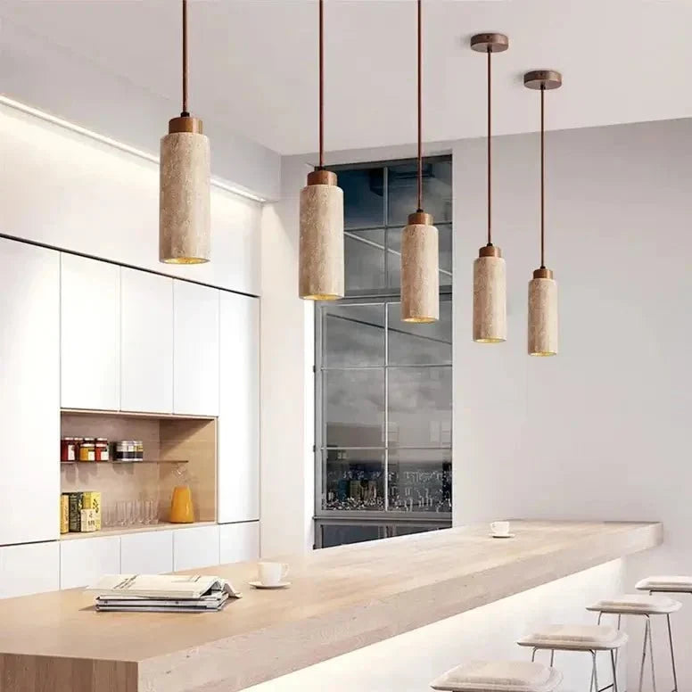 Brio travertine pendant illuminated over a kitchen island