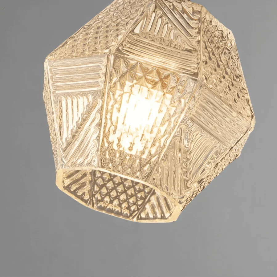 Detail of the soft glass shade and brass body on the Palermo light