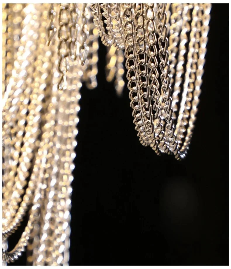Full view of the Cadena 47-inch chain tassel dining room chandelier by Morsale.com, stainless steel and aluminum.