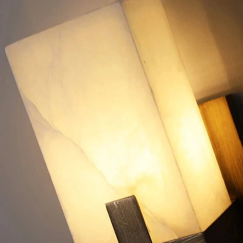 Altara marble wall sconce mounted on a wall