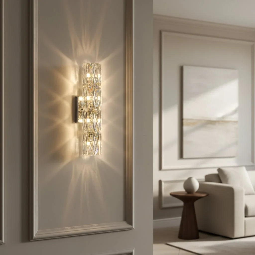 Bacci linear crystal sconce illuminated on a wall