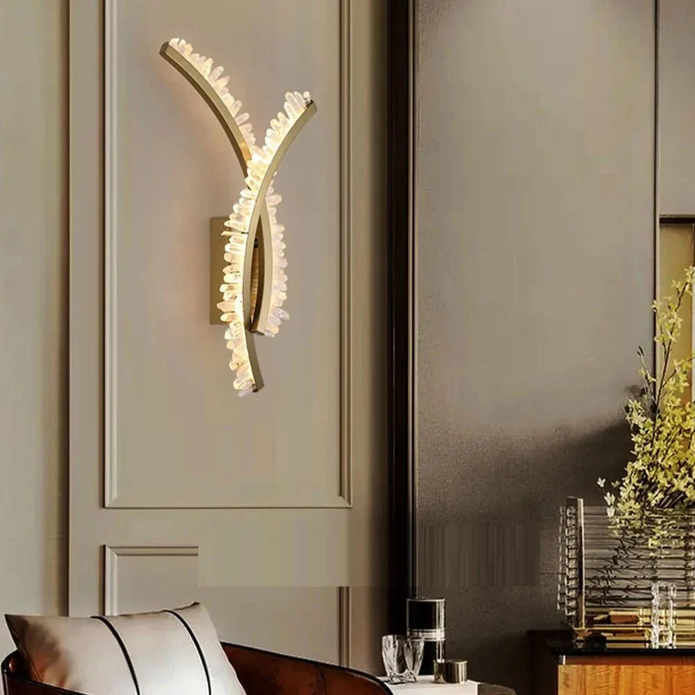 Orion crystal sconce illuminated on a wall