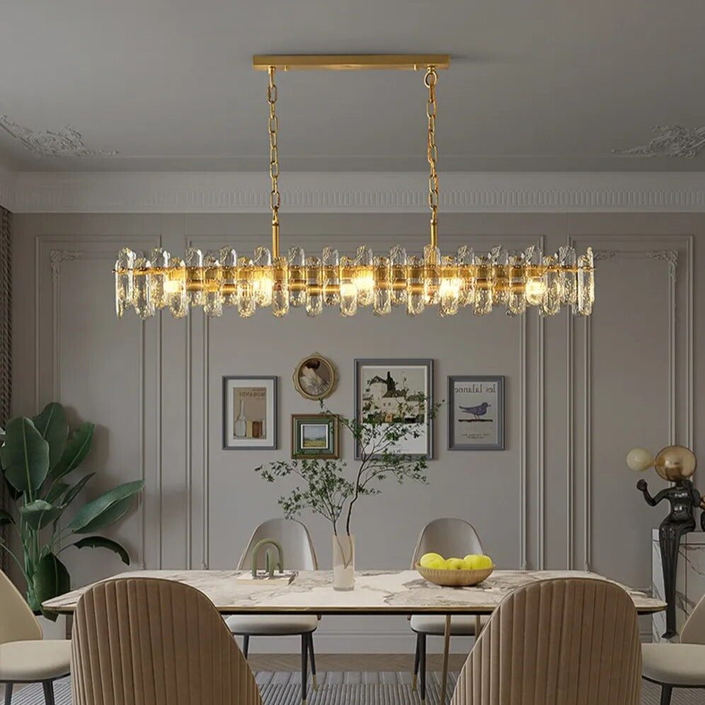 Marini 59-inch linear crystal chandelier over a long dining table