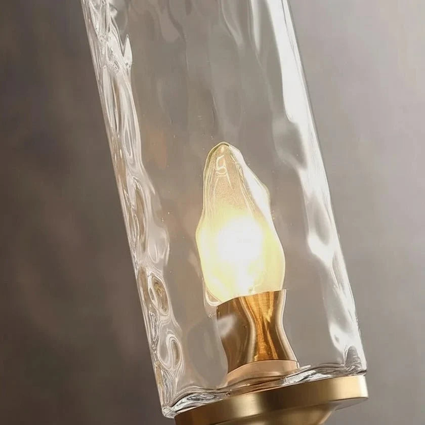Romea copper wall sconce mounted on a wall