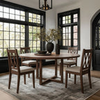 Dining room with wooden table and chairs, modern light fixture, and large plant on the table