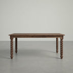 Walnut dining table in a large, empty space