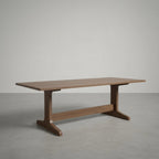 Wooden dining table on a plain background