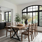 Dining room with wooden table and chairs near large windows